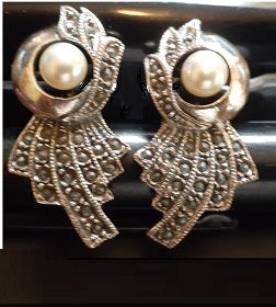 The appearance of a flower will adorn your ears.  A pair of pearls adds to the look