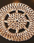 Cowry shells can be used as a candle or incense holder. The shells are known for their sexual energy and are used in spiritual rituals.